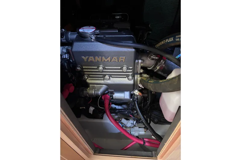 Slide: The Image of Yanmar engine in a 2015 Beneteau Oceanis 35 sailboat, showcasing detailed components. - 23