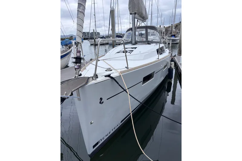 Slide: The Image of 2015 Beneteau Oceanis 35 sailboat docked in a marina. - 7
