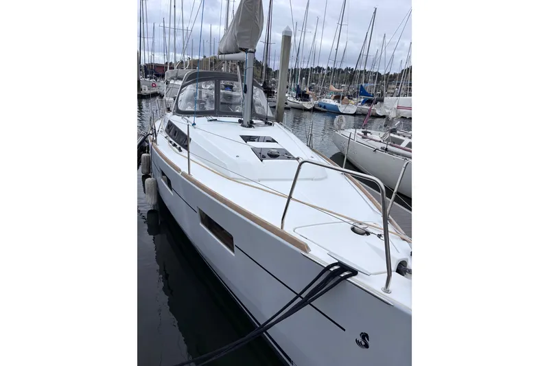 Slide: The Image of 2015 Beneteau Oceanis 35 sailboat docked in a marina, showcasing sleek design and modern features. - 8