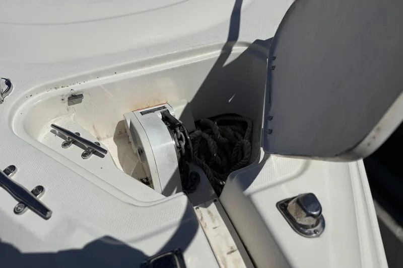 Slide: The Image of Anchor compartment of 2004 Chaparral Signature 260 boat with open hatch. - 12