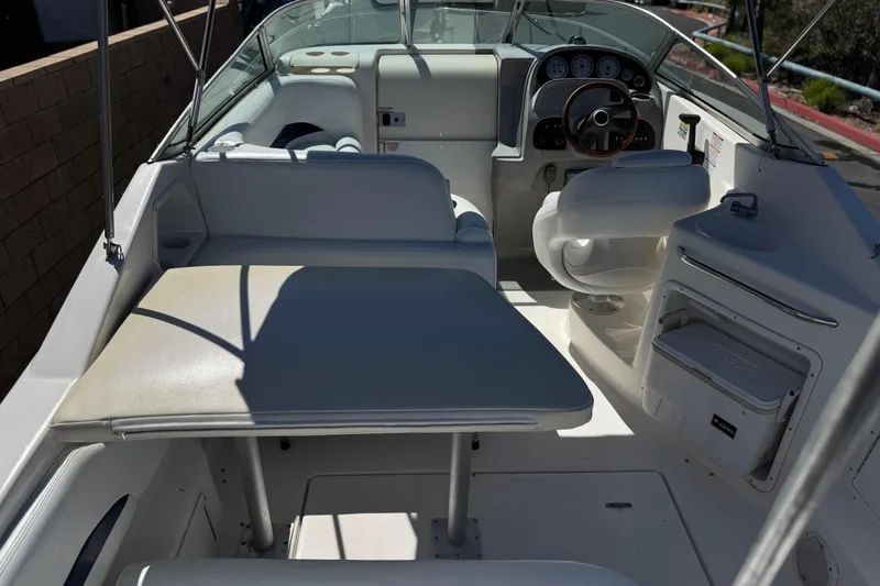 Slide: The Image of 2004 Chaparral Signature 260 boat interior with seating, steering wheel, and dashboard. - 14