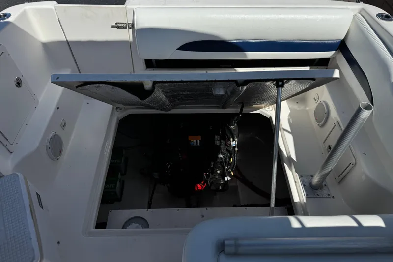 Slide: The Image of Open engine compartment of a 2004 Chaparral Signature 260 boat. - 19