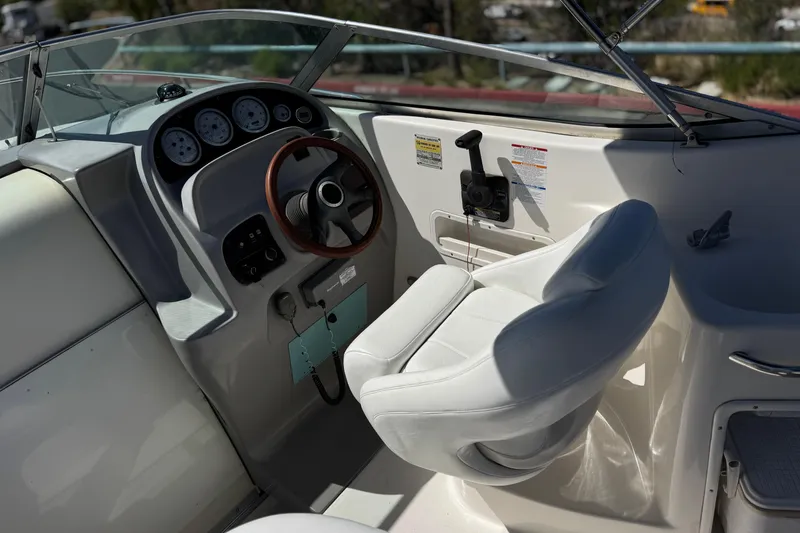 Slide: The Image of 2004 Chaparral Signature 260 boat cockpit with steering wheel and gauges. - 23