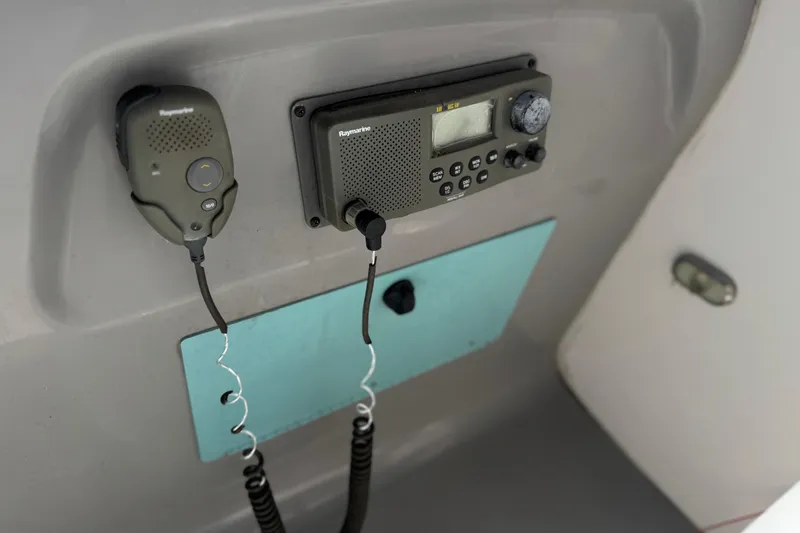 Slide: The Image of 2004 Chaparral Signature 260 boat radio and communication equipment panel. - 25