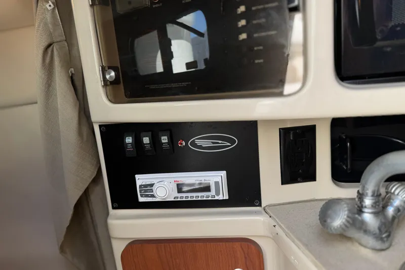 Slide: The Image of 2004 Chaparral Signature 260 boat interior with control panel and stereo system. - 31