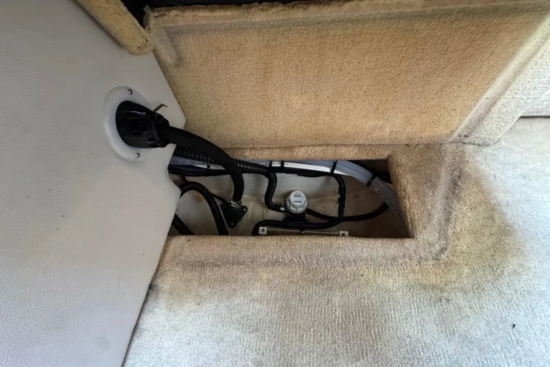 Slide: The Image of 2004 Chaparral Signature 260 boat interior wiring and plumbing compartment. - 37