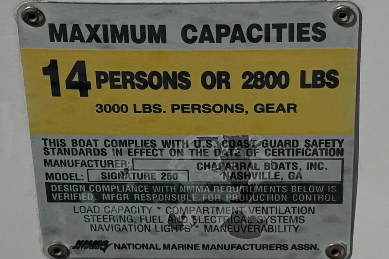 Slide: The Image of 2004 Chaparral Signature 260 capacity plate: 14 persons or 2800 lbs, 3000 lbs with gear. - 38