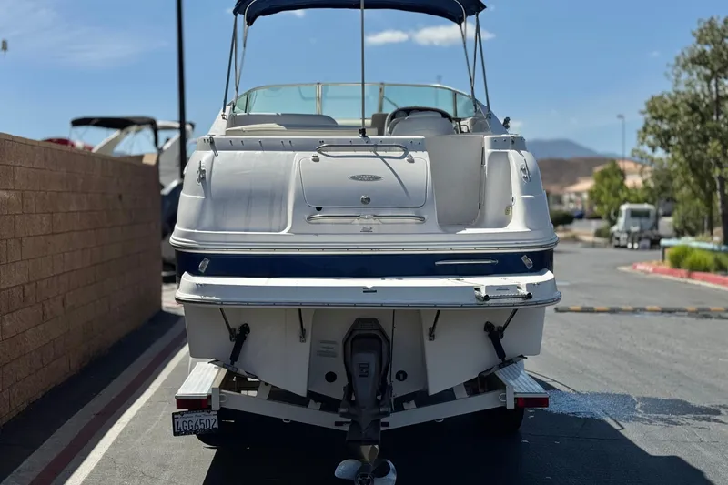 Slide: The Image of 2004 Chaparral Signature 260 boat on trailer, rear view, sunny day. - 4