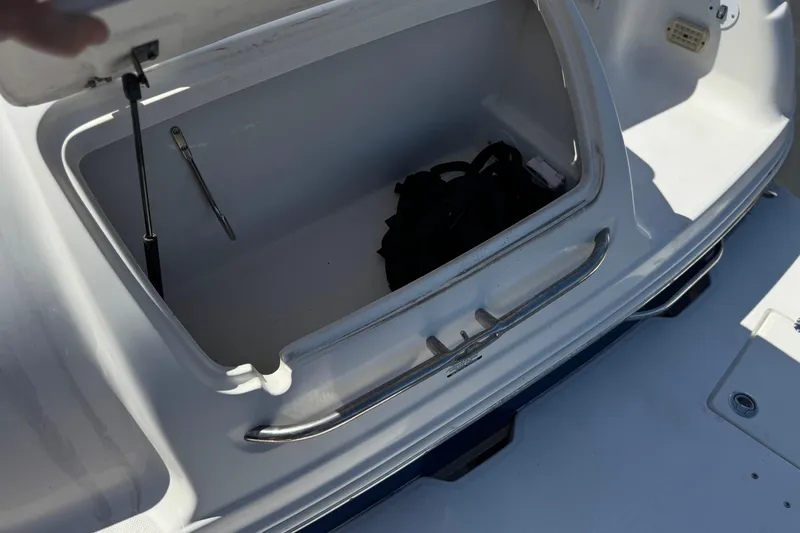 Slide: The Image of Open storage compartment on 2004 Chaparral Signature 260 boat, showing interior space. - 6
