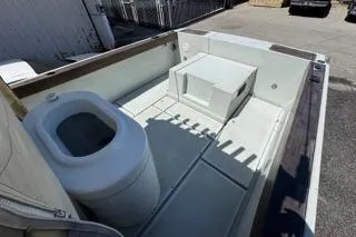 Slide: The Image of 1990 Davis Radon Craft 22 boat interior with seating and storage compartments. - 10