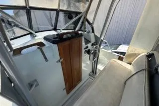 Slide: The Image of 1990 Davis Radon Craft 22 boat interior with steering wheel and seating. - 11