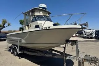 Slide: The Image of 1990 Davis Radon Craft 22 boat on trailer in outdoor setting. - 3