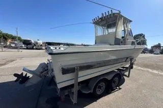 Slide: The Image of 1990 Davis Radon Craft 22 boat on trailer in parking lot. - 4