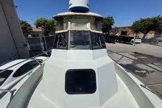 Slide: The Image of 1990 Davis Radon Craft 22 boat docked outdoors on a sunny day. - 7