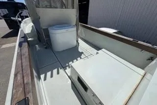 Slide: The Image of 1990 Davis Radon Craft 22 boat interior with seating and storage compartments. - 9