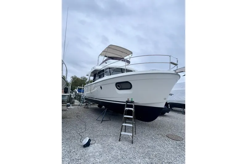 Slide: The Image of 2020 Beneteau Swift Trawler 35 on dry dock, showcasing sleek design and sturdy build. - 8