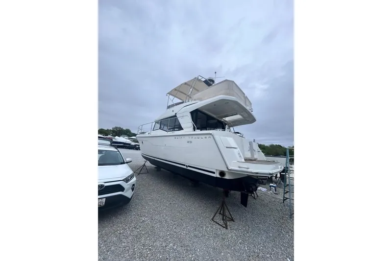 Slide: The Image of 2020 Beneteau Swift Trawler 35 on display in a boatyard. - 9