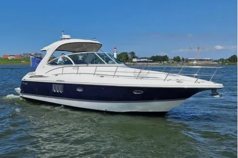 The Image of 2007 Cruisers 420 yacht cruising on a sunny day with clear blue skies. - 0