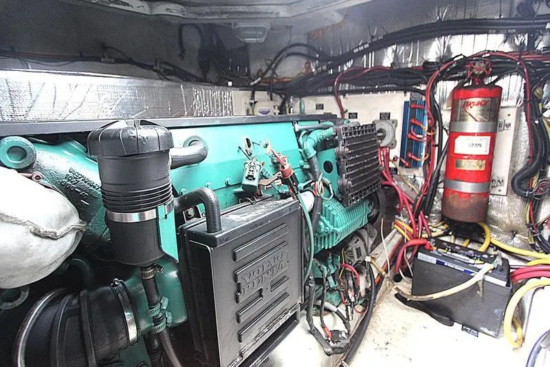 Slide: The Image of Engine room of a 2007 Cruisers 420 boat with Volvo Penta engine and wiring. - 16