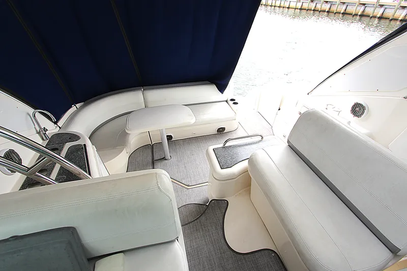 Slide: The Image of 2007 Cruisers 420 yacht interior with seating and table, featuring elegant design and waterfront view. - 6