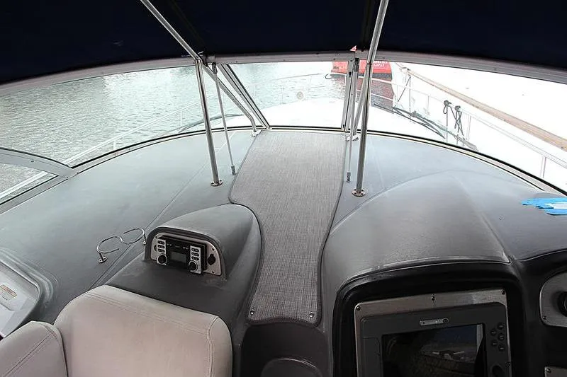 Slide: The Image of 2007 Cruisers 420 yacht helm with navigation equipment and water view. - 8