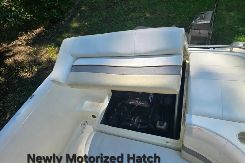 Slide: The Image of 2001 Smoker Craft 2310 Commander with newly motorized hatch, showcasing engine compartment. - 15
