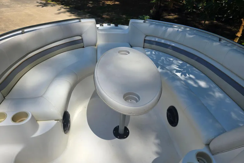 Slide: The Image of Spacious seating area on 2001 Smoker Craft 2310 Commander boat with table and cup holders. - 16