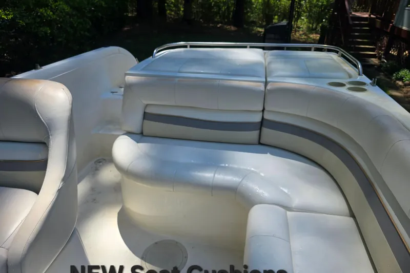 Slide: The Image of 2001 Smoker Craft 2310 Commander boat with new white seat cushions. - 17