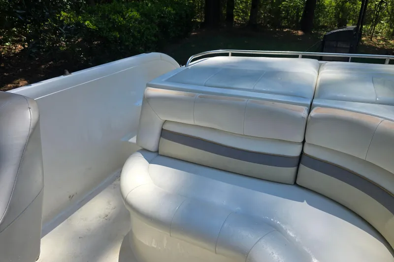 Slide: The Image of 2001 Smoker Craft 2310 Commander boat interior with white cushioned seating. - 19