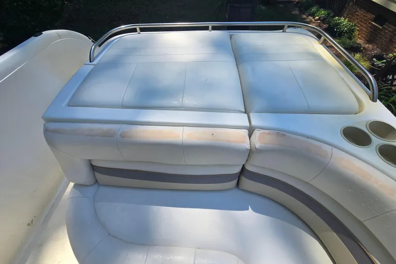 Slide: The Image of 2001 Smoker Craft 2310 Commander boat seating area with cup holders and railing. - 27