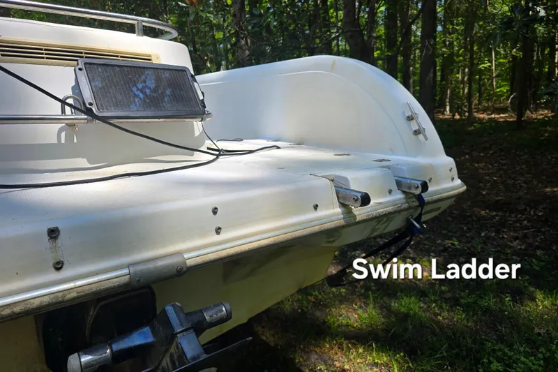 Slide: The Image of 2001 Smoker Craft 2310 Commander boat with swim ladder and solar panel. - 7