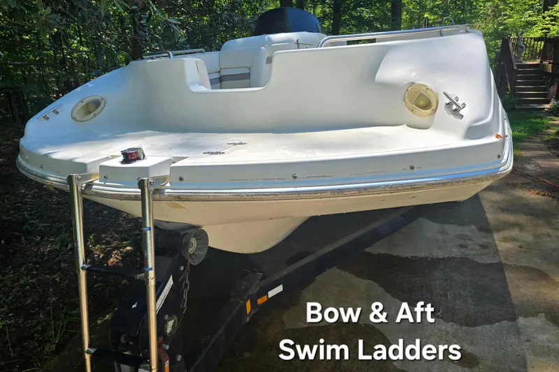 Slide: The Image of 2001 Smoker Craft 2310 Commander boat with bow and aft swim ladders. - 8