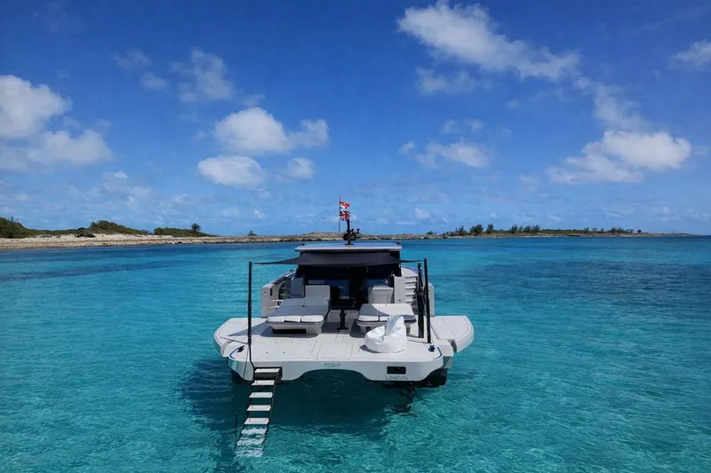 Slide: The Image of Luxury Sunreef Ultima 2026 yacht anchored in crystal-clear turquoise waters. - 2