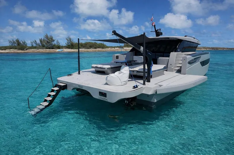 Slide: The Image of Luxury Sunreef Ultima 2026 yacht anchored in clear turquoise waters, featuring sleek modern design. - 6
