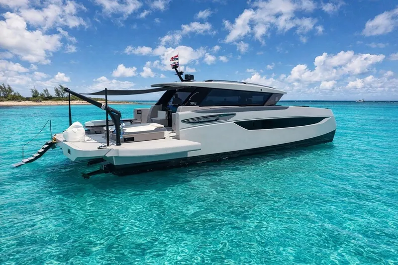 Slide: The Image of Luxury Sunreef Ultima 2026 yacht on clear turquoise water, under a bright blue sky. - 9