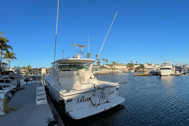 The Image of 2002 Tiara Yachts 4100 Open docked in a sunny marina setting. - 0