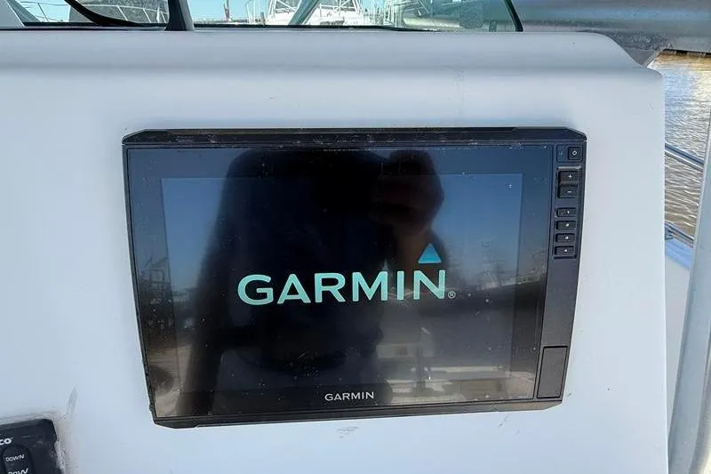 Slide: The Image of Garmin display on 2003 Robalo R230 Center Console boat dashboard. - 15