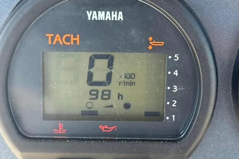Slide: The Image of Yamaha tachometer displaying 98 hours on a 2003 Robalo R230 Center Console boat. - 17