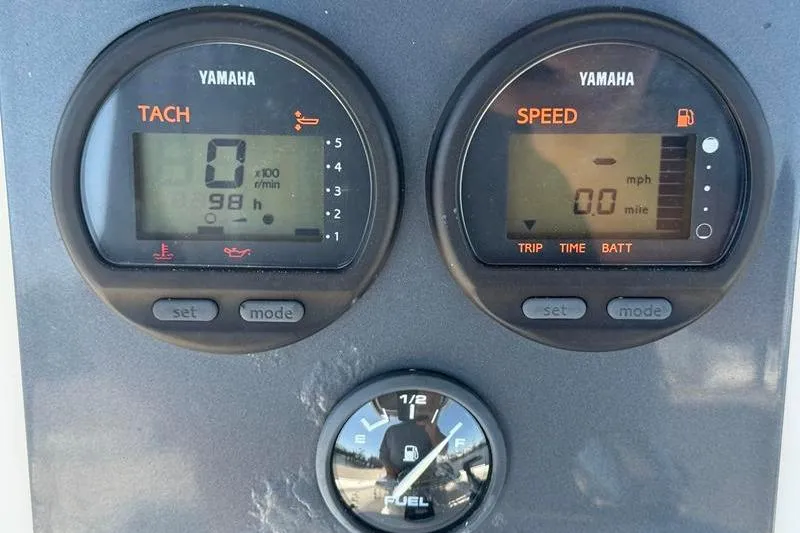 Slide: The Image of Yamaha tachometer and speedometer on 2003 Robalo R230 Center Console boat dashboard. - 18