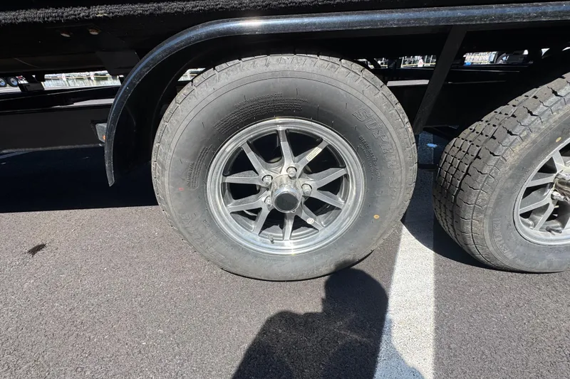 Slide: The Image of Close-up of 2021 Crest RS250 trailer wheels on asphalt surface. - 11