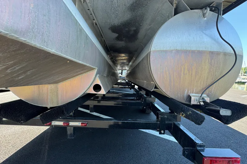 Slide: The Image of Underneath view of a 2021 Crest RS250 pontoon boat on a trailer. - 15