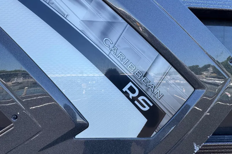 Slide: The Image of 2021 Crest RS250 Caribbean boat detail with sleek design and reflective surface. - 17