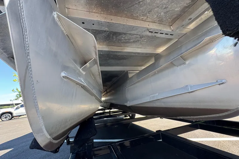 Slide: The Image of Underneath view of a 2021 Crest RS250 pontoon boat on a trailer. - 20
