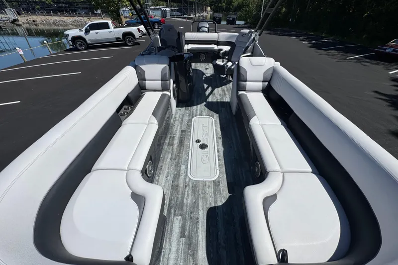 Slide: The Image of 2021 Crest RS250 pontoon boat interior with spacious seating and modern design. - 25