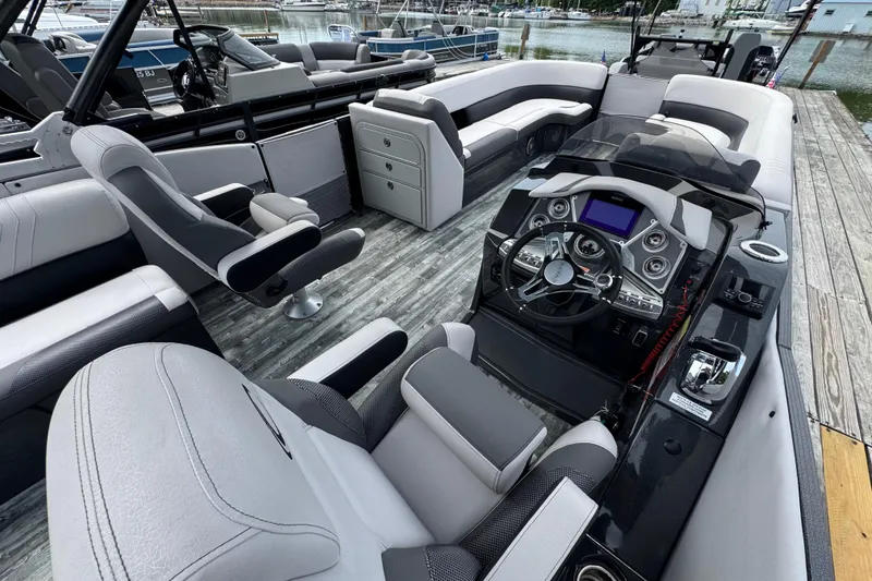 Slide: The Image of Luxurious 2021 Crest RS250 boat interior with modern dashboard and comfortable seating. - 27