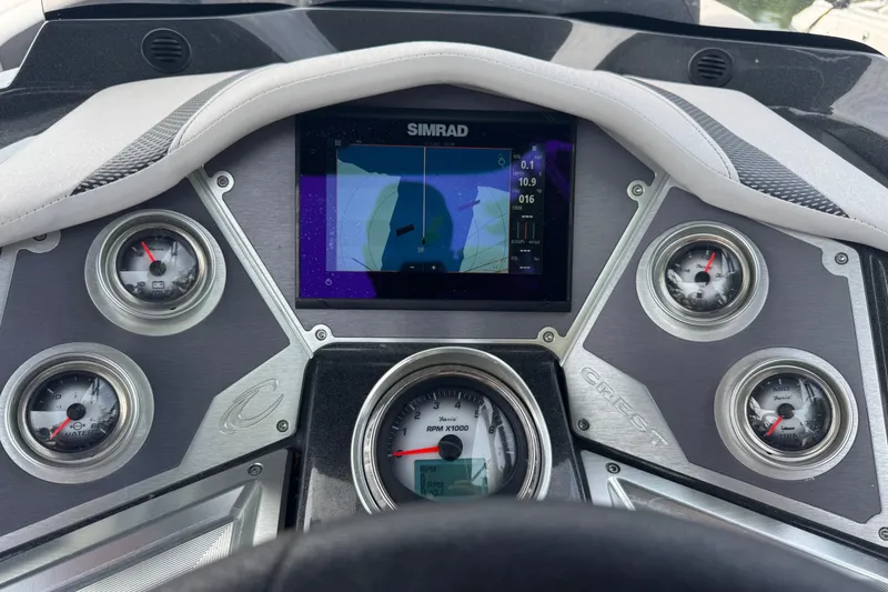 Slide: The Image of Dashboard of a 2021 Crest RS250 boat with Simrad navigation display. - 29