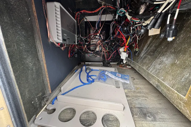 Slide: The Image of Interior view of a 2021 Crest RS250 boat showing wiring and electronic components. - 34