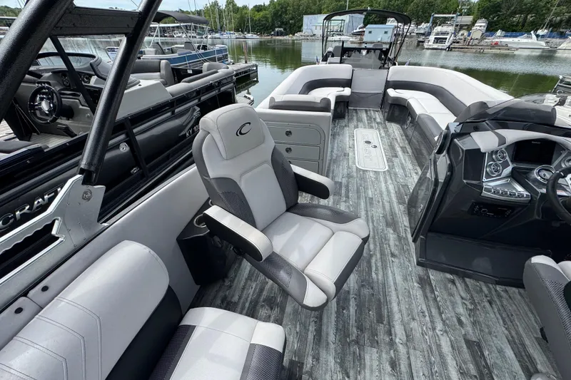 Slide: The Image of Luxurious 2021 Crest RS250 boat interior with modern seating and sleek dashboard design. - 35