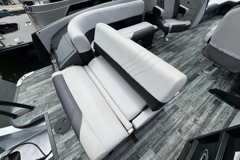Slide: The Image of 2021 Crest RS250 boat interior with gray seating and wood-style flooring. - 45