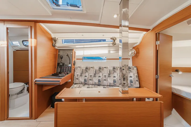 Slide: The Image of Interior of 2022 Jeanneau Sun Odyssey 349 sailboat, featuring modern design and cozy seating area. - 12